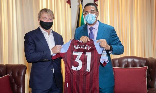 PM Holness gifted Leon Bailey jersey by American billionaire